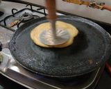A picture of step 2 of Palak paneer parathapizza.
