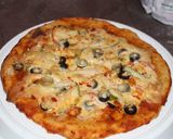 A picture of step 8 of Chicken tikka pizza without oven.