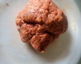 A picture of step 2 of BBQ Bacon-Wrapped Burger-Stuffed Onion Bombs.