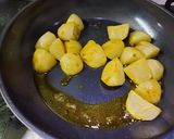 A picture of step 1 of Achari Aloo.