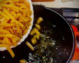 A picture of step 4 of Pasta with Tomato and Cheese Sauce.