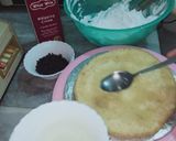 A picture of step 3 of Vanilla cream cake with chocolate chips inside.
