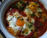 A picture of step 8 of Saganaki with Country Sausage, Eggs, and Graviera Cheese.