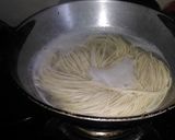 A picture of step 1 of Atta garlic noodles with boiled eggs.