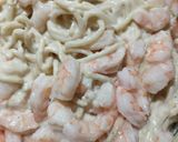 A picture of step 9 of Creamy alfredo chicken and shrimp pasta.