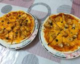 A picture of step 4 of Instant chicken Tikka Pizza in frying pan.
