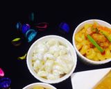 A picture of step 14 of Black pepper pineapple chicken with boil rice, macaroni, salad,chilli, sauces, lemon pepper drink.