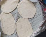 A picture of step 2 of Pita bread with falafel and tahini sauce.