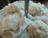 A picture of step 4 of Sweet Puttu (steamed rice cake from Kerala) with coconut.