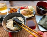 A picture of step 7 of Japanese Breakfast (how to eat Nori seaweed and rice).