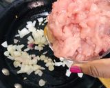 A picture of step 4 of Homemade Ground Chicken (with a knife).