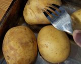 A picture of step 1 of "loaded" stuffed potato skins.