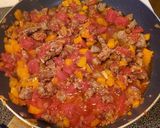 A picture of step 3 of Sausage scramble on Italian bread.