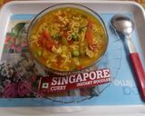 A picture of step 5 of Singapore curry noodles soup.