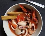A picture of step 5 of Thai Lemongrass Tomato Seafood Hot and Sour Soup.
