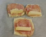 A picture of step 3 of Ham and Cheese Toasted Roll Ups.