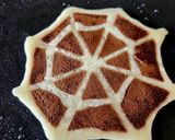 A picture of step 3 of Halloween Spiders And Chocolate Vanilla Eggless Spiderweb Pancake.