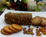 A picture of step 12 of Biscuits Meethi (Swiss roll style).