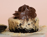 A picture of step 10 of Mini Oreo Cheesecakes with Chocolate Ganache.