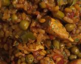 A picture of step 7 of Paella Rice with Chicken and Vegetables.
