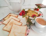 A picture of step 7 of Spring Onion omellete ! Sandwich ! With hot tea ☕.