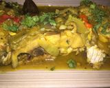 A picture of step 4 of Fish peepered soup garnish with parsely.