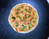 A picture of step 3 of Thin crust chicken shrimp pizza (stovetop).