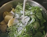 A picture of step 2 of Purslane Soup with Goat Cheese Whipped Cream and Hazelnut Oil.