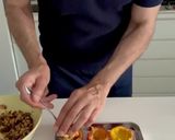 A picture of step 4 of Baked Peaches with Amaretti, Dark Chocolate, Ice Cream and Mint.
