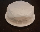 A picture of step 31 of White Layer Cake with a Raspberry Swirl Cheesecake center layer and a Raspberry Cream Frosting.