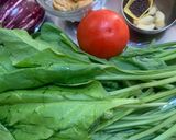 A picture of step 1 of Palak with brinjal and badi.