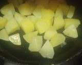 A picture of step 4 of Masaledaar Khattey aloo.