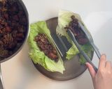A picture of step 6 of Korean Black Bean Chicken Lettuce Wraps.