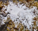 A picture of step 3 of Corn fritters in appe pan.