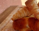 Foto del paso 11 de la receta Trenza brioche de crema y pepitas de chocolate con conitos de hojaldre