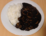 Foto del paso 4 de la receta: Calamares en su tinta con arroz blanco