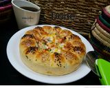 A picture of step 8 of Bubble pizza.