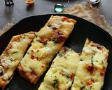 A picture of step 5 of Chessey garlic naan sticks.