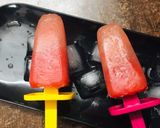 A picture of step 6 of Watermelon Lemonade Popsicles.