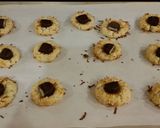 A picture of step 9 of Toasted Coconut Thumbprint Cookies.