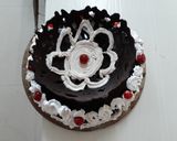 A picture of step 19 of Chocolate mirror glaze malai cake.