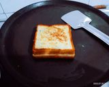 A picture of step 3 of Amul cheese spread vegetable sandwich.