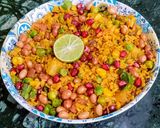 A picture of step 4 of Red Poha Masala With Veggies, Sprouts and Nuts.