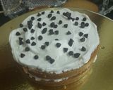 A picture of step 8 of White Forest Football cake.
