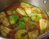 A picture of step 3 of Jowar Bhakri with brinjal potato vegetable curry.