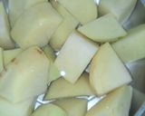 A picture of step 1 of Green coriander & potato curry.