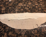 Foto del paso 5 de la receta: Espiral de hojaldre rellena de queso