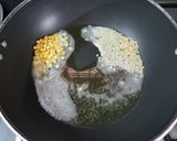 A picture of step 2 of Tamarind leaves rice.