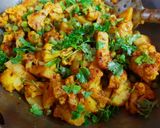 A picture of step 5 of Aloo Gobi Matar (Potato, Cauliflower, and Pea Curry).