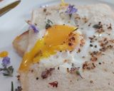 A picture of step 7 of Savoury Rosemary Flower Egg in a Hole.